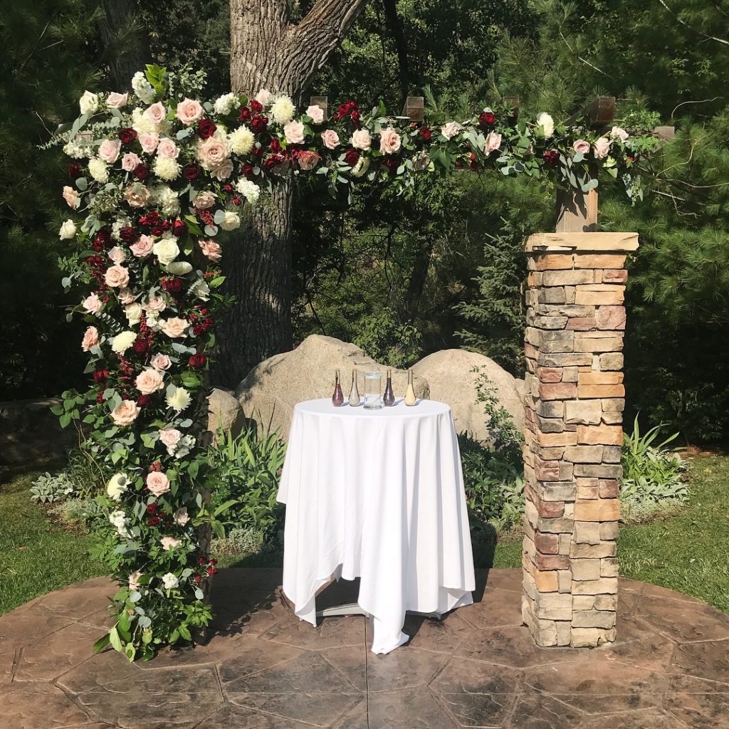 Amazing arch featuring rose-heavy florals