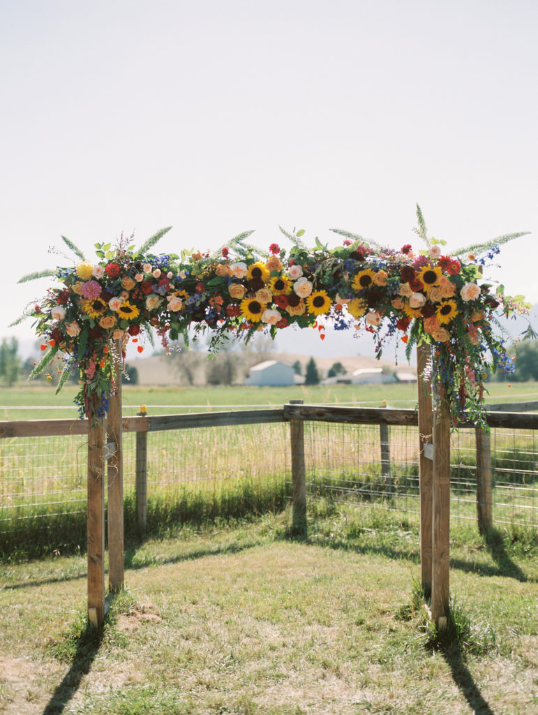 Amazing arch featuring sunflowers and abundant wildflowers