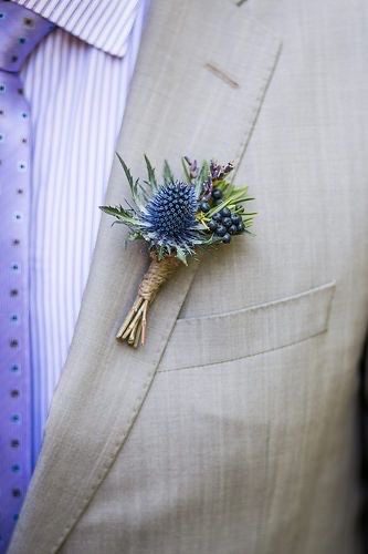 Using fewer flowers by not using blooms in the boutonniere. This one uses thistle instead
